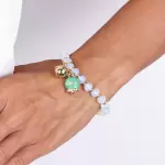 Bracciale in Metallo campanella verde e piccolo sonaglio con pietre bianche